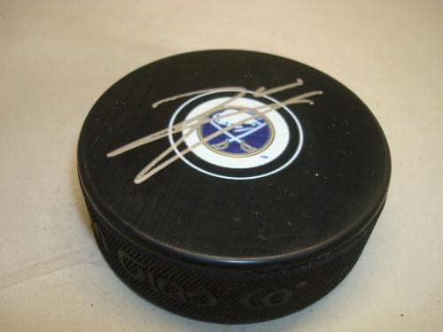 Реми Ели подписа хокей шайба Бъфало Сейбърс с автограф от 1B - за Миене на НХЛ с автограф